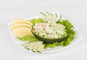 Crab meat salad with green caviar in avocado - japan cusine photo