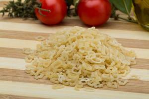 ABC macaroni on wooden background photo