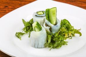 Squid sashimi on the plate and wooden background photo