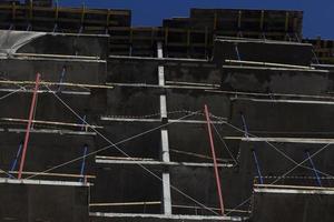 Construction of residential building. Wall of unfinished building. Construction details. Preparation of walls for cladding. photo