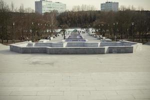 View of city park. Cascading fountain in city. photo