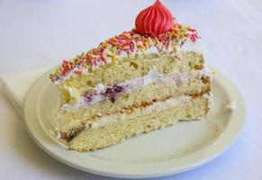 Fresh cake on the plate and white background photo