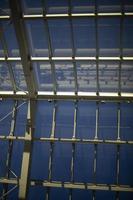 Glass roof in shopping mall. Steel beams and glass. Architecture details. photo