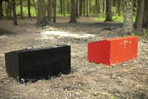 Two boxes in woods. Storage for sand. Safety equipment for firefighting. photo