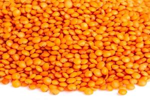 red lentils isolated on white photo