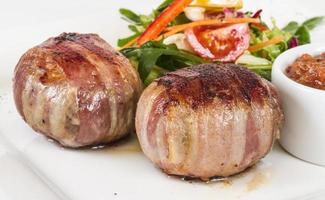 Grilled steak wrapped in bacon, with grilled vegetables, mashed potatoes photo