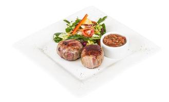 Grilled steak wrapped in bacon, with grilled vegetables, mashed potatoes photo