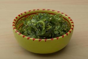 Chuka salad in a bowl on wooden background photo