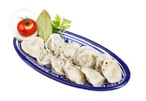 Bowl with traditional russian dish - pelmeni photo