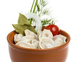 Bowl with traditional russian dish - pelmeni photo