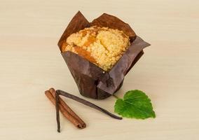 Muffin on wooden background photo