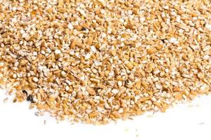 Pearl barley heap isolated on white photo