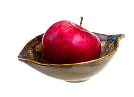 fresh red apples in the dish isolated on white background photo