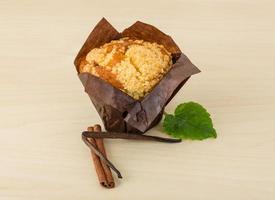 Muffin on wooden background photo