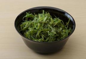 Chuka salad in a bowl on wooden background photo