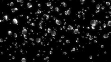 ciclo continuo caduta giù bolla particelle animazione su nero sfondo. video