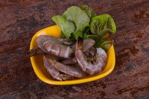 Raw king prawns ready for cooking photo