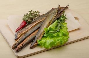 Lamprey on wooden board and wooden background photo