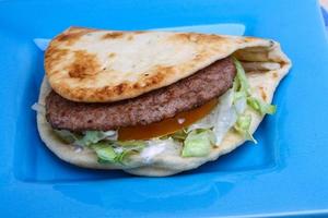 Greek pita on the plate photo