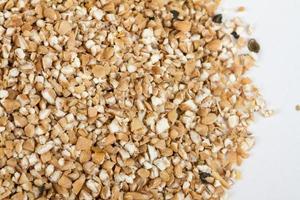 Pearl barley heap isolated on white photo