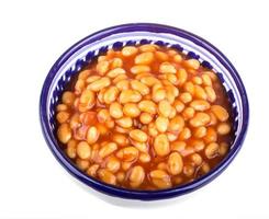 Marinated haricot beans in tomato sauce with shallots on a plate photo