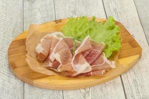 Italian prosciutto pork meat over board photo