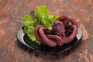 Boiled octopus with herbs photo