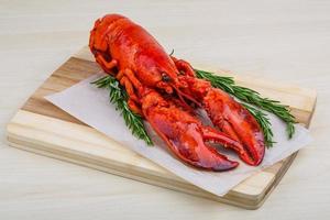 Lobster on wooden board and wooden background photo