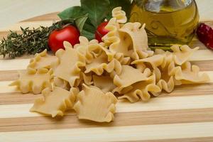 Tatarian pasta on wooden background photo