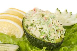 Crab meat salad with green caviar in avocado - japan cusine photo