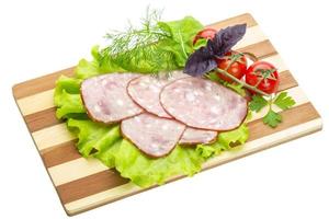 Sausages with salad and basil photo