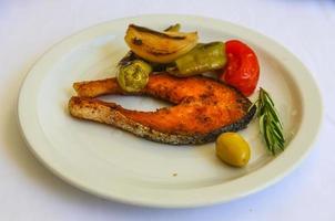 Grilled salmon on white background photo