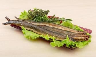 Lamprey in a bowl on wooden background photo