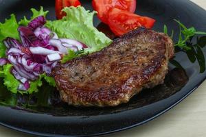 Beefsteak on the plate photo