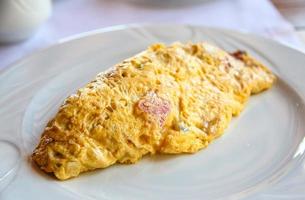 Omelet on the plate and white background photo