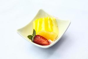 Banana pudding in a bowl on white background photo