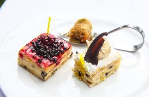 Mini cakes on the plate photo
