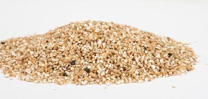 Pearl barley heap isolated on white photo