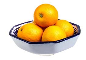 Heap of oranges in the dish photo