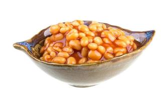 Marinated haricot beans in tomato sauce with shallots on a plate photo