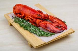 Lobster on wooden board and wooden background photo