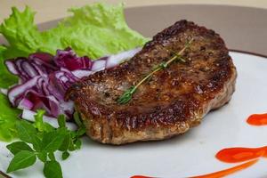 Beefsteak on the plate photo