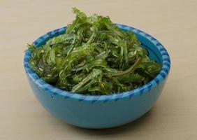 Chuka salad in a bowl on wooden background photo