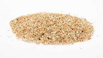 Pearl barley heap isolated on white photo