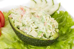 Crab meat salad with green caviar in avocado - japan cusine photo