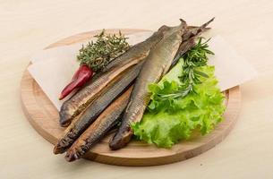 Lamprey on wooden board and wooden background photo