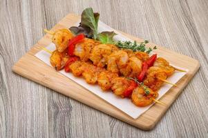 Raw tiger shrimps skewer photo