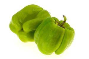 Two Green bell pepper isolated on white photo