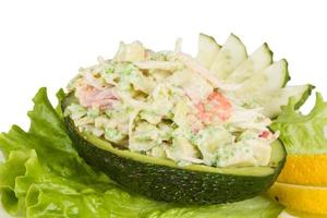 Crab meat salad with green caviar in avocado - japan cusine photo