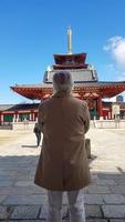 Tokyo, Japan on April 15, 2019. An old man prays at a temple in Japan. photo